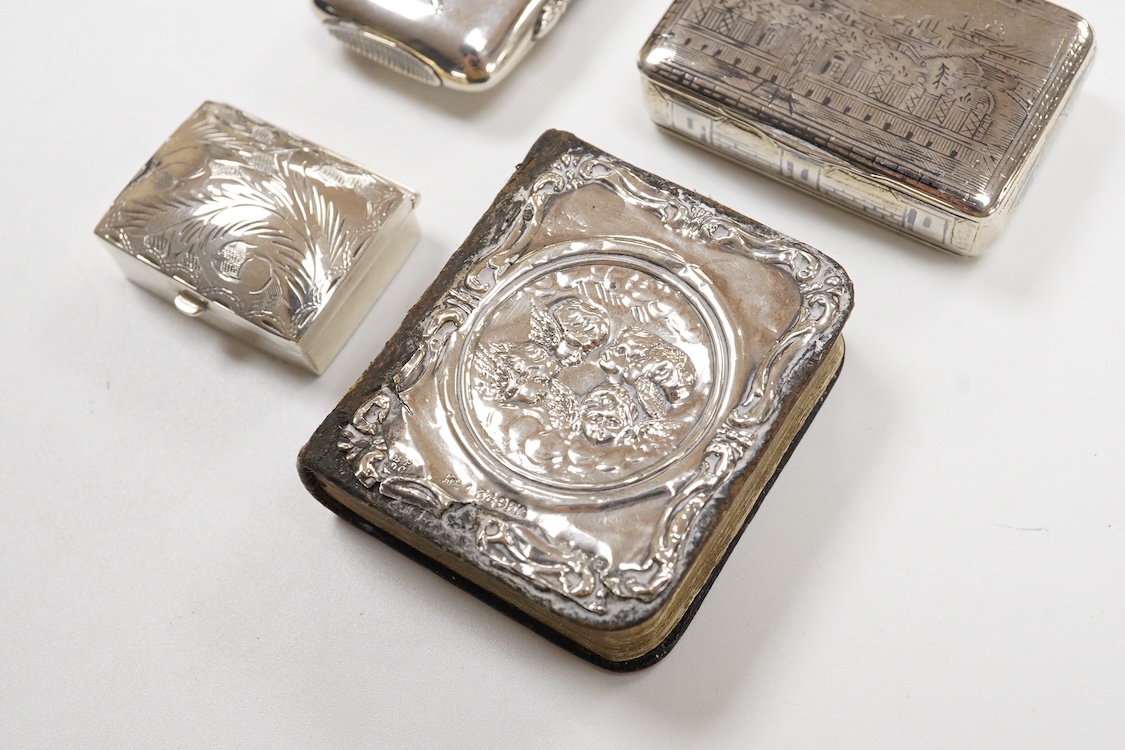 A Japanese white metal and polychrome enamel vesta case, decorated with flowers and butterfly, 56mm, together with a 19th century Russian 84 zolotnik and niello snuff box(tired), a modern silver pill box and a silver mou